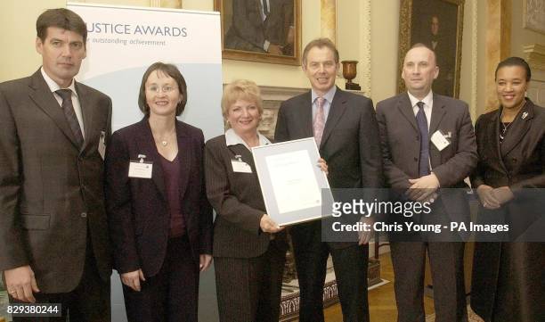 Prime Minister Tony Blair and the Home Office Minister Baroness Scotland present the Criminal Justice System Innovation to the Snaresbrook Crown...