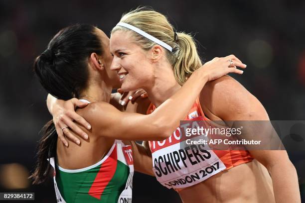 Netherlands' Dafne Schippers is congratulated by Bulgaria's Ivet Lalova-Collio after winning heat 1 in the semi-final of the women's 200m athletics...