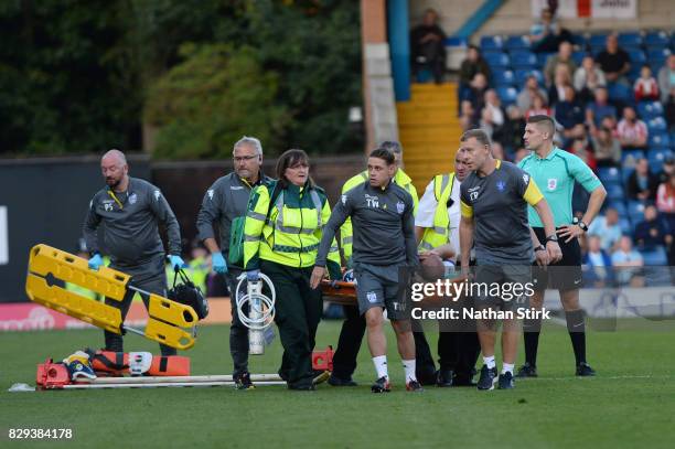 Stephen Dawson of Bury is stretchered off during the Carabao Cup First Round match between Bury and Sunderland at Gigg Lane on August 10, 2017 in...