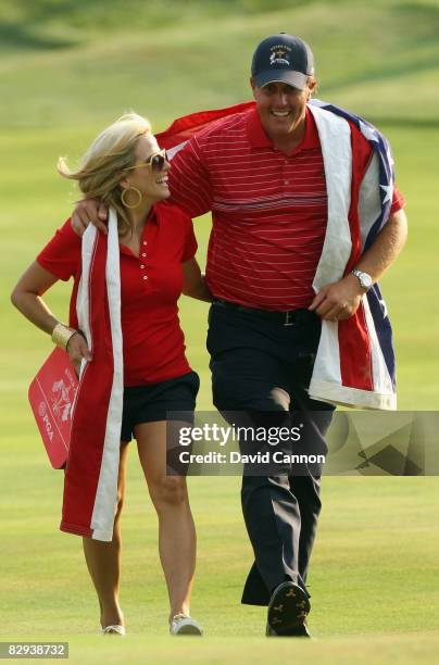 Phil Mickelson of the USA team walks to the clubhouse with his wife Amy after the USA 16 1/2-11 1/2 victory over Europe on the final day of the 2008...