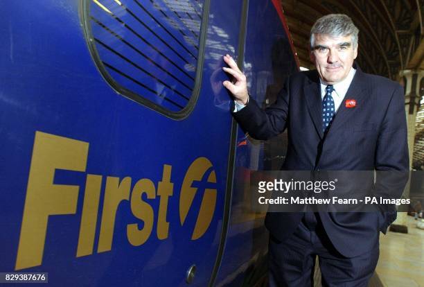 First Group Chief Executive Moir Lockhead stands by a First Great Western train at London's Paddington Station. The UK's largest public transport...