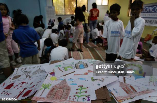Underprivileged children and students of Billabong High School at a Warli Art Workshop at Ajeebasen School, organised by Concern India Foundation and...