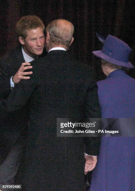 Prince Harry greets his grandparents, the Queen and the Duke of Edinburgh at the wedding of Lady Tamara Grosvenor to Edward van Cutsem at Chester...
