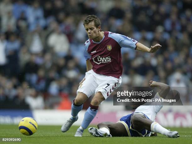 Aston Villa's Lee Hendrie is tackled by Portsmouth's Valery Mezague during the Barclays Premiership match at Villa Park, Birmingham, Saturday,...