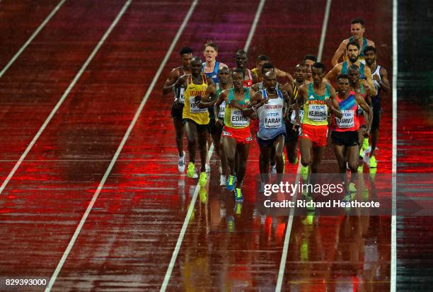 Yomif Kejelcha of Ethiopia leads heat one of the Men's 5000 Metres heats ahead of Mohamed Farah of Great Britain and Muktar Edris during day six of...