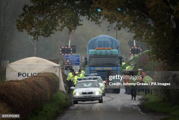 Lorry carries away part of the wreckage from last Saturday's train crash which occurred when a car came to a halt on a level crossing causing the...