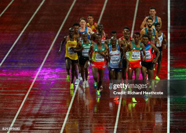 Yomif Kejelcha of Ethiopia leads heat one of the Men's 5000 Metres heats ahead of Mohamed Farah of Great Britain and Muktar Edris during day six of...