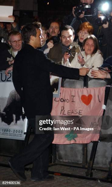 Singer Robbie Williams greets fans, as he arrives for the UK Music Hall Of Fame - live final, at the Hackney Empire in east London. The Channel 4...