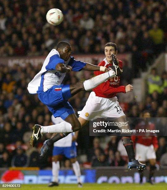 Crystal Palace's Darren Powell and Manchester United's John O'Shea contest the ball during the Carling Cup, fourth round match at Old Trafford,...