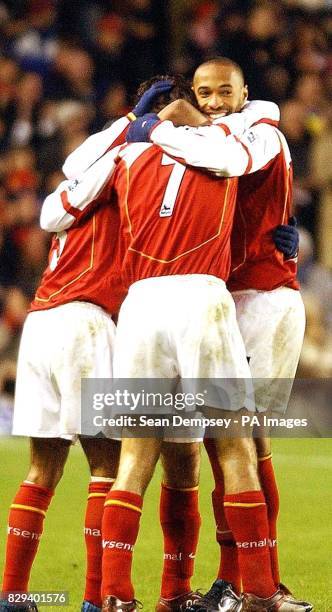 Arsenal's Robert Pires celebrates with team mates, his goal against West Bromwich Albion during the Barclays Premiership match at Highbury, north...