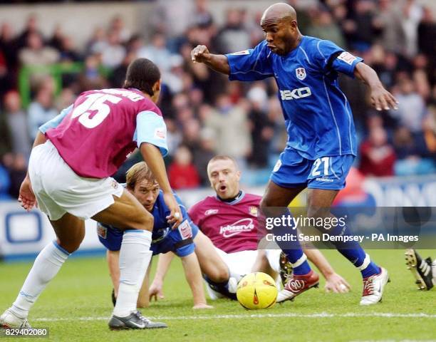 Millwall's Barry Hayles is faced by West Ham United's Anton Ferdinand during the Coca-Cola Championship match at the Den, in London. THIS PICTURE CAN...