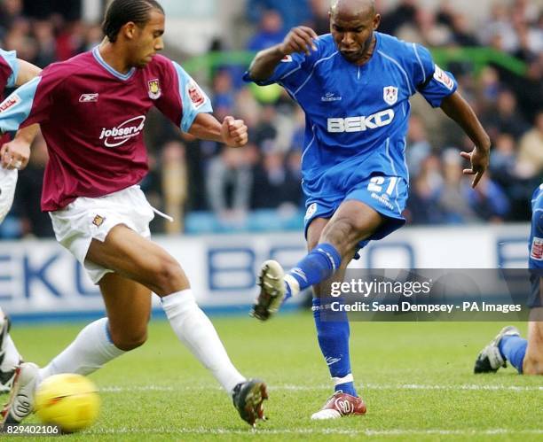 Millwall's Barry Hayles is faced by West Ham United defender Anton Ferdinand during the Coca-Cola Championship match at the Den, in London. THIS...