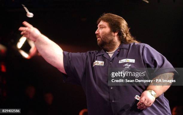 Andy Fordham launches his dart during the head-to-head showdown against Phil 'The Power' Taylor at Circus Tavern, Purfleet. Fordham has the...