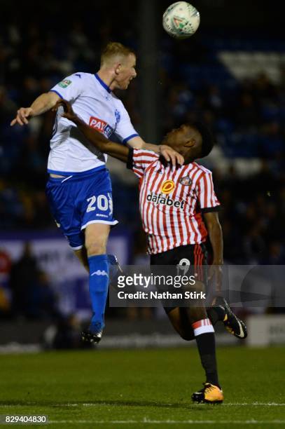 Alex Whitmore of Bury and Joel Asoro of Sunderland compete for the ball during the Carabao Cup First Round match between Bury and Sunderland at Gigg...