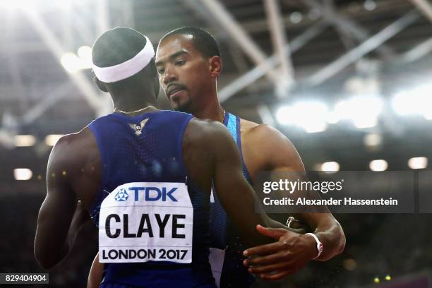 Christian Taylor gold and Will Claye silver of the United States celebrate with USA flag after the mens triple jump final during day seven of the...