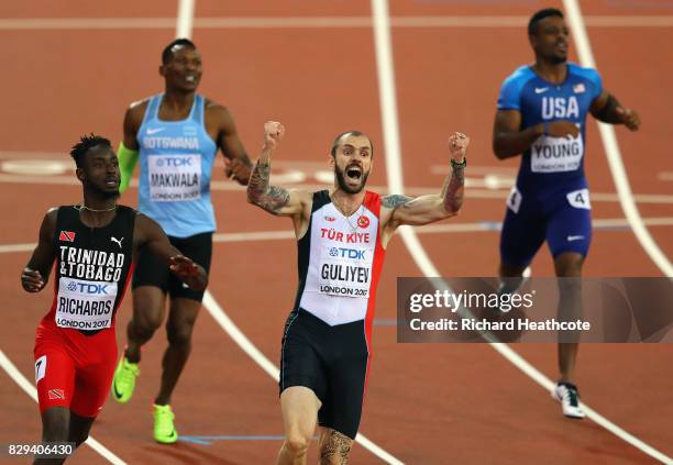 Ramil Guliyev of Turkey celebrates next to Jereem Richards of Trinidad and Tobago as he crosses the line to win the mens 200 metres final during day...