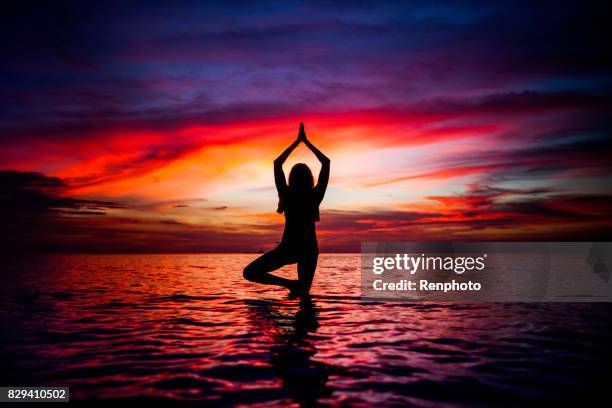 yoga at zen beach - new age stock pictures, royalty-free photos & images