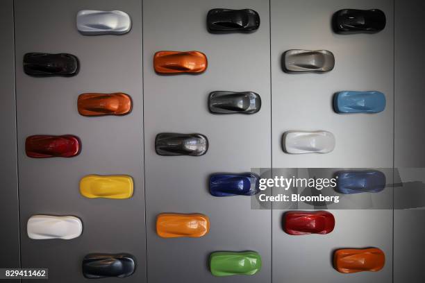 Paint choices for vehicles are displayed on a wall inside the McLaren Newport Beach dealership in Newport Beach, California, U.S., on Tuesday, July...