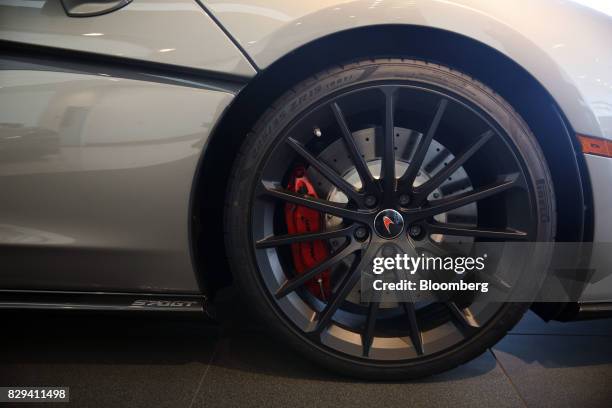 The hubcap of a McLaren Automotive Ltd. 570GT is seen on a vehicle inside the McLaren Newport Beach dealership in Newport Beach, California, U.S., on...