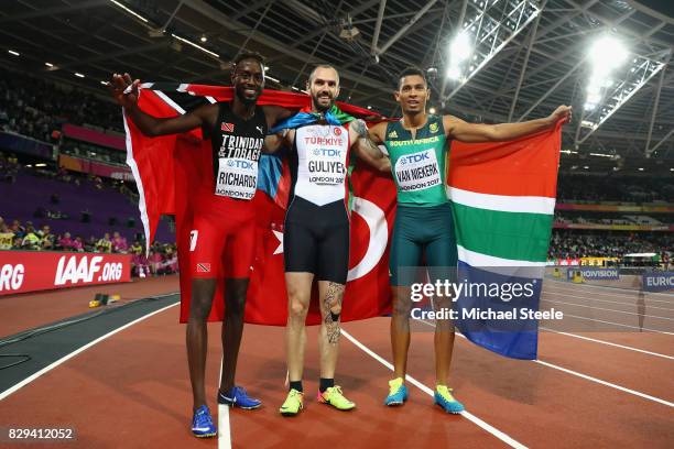 Ramil Guliyev of Turkey gold, Jereem Richards of Trinidad and Tobago, silver and Wayde van Niekerk of South Africa celebrate following the result in...