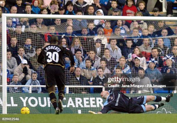 Jason Roberts of Wigan Athletic scores his side's first goal against Reading during the Coca-Cola Championship match at The Madejski Stadium,...