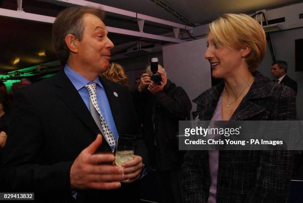 British Prime Minister Tony Blair chats to runner Paula Radcliffe at a reception for the Olympic and Paralympic athletes who competed at this year's...