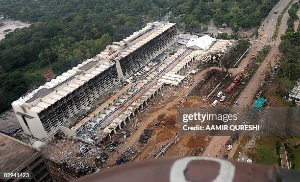 An aerial view taken from an army helicopter shows the devastated Marriott Hotel two days after a suicide truck bombing in Islamabad on September 22,...