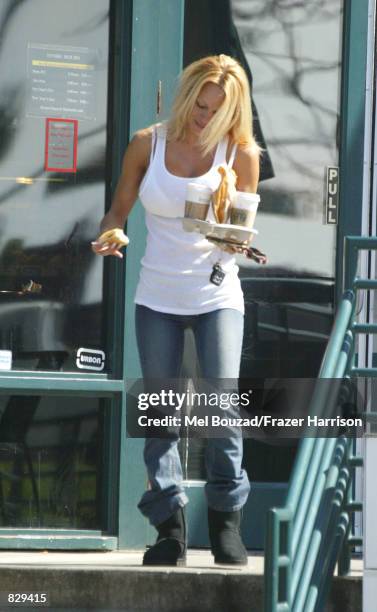 Actress Pamela Anderson buys coffee at Starbuck's February 26, 2002 in Malibu, CA.