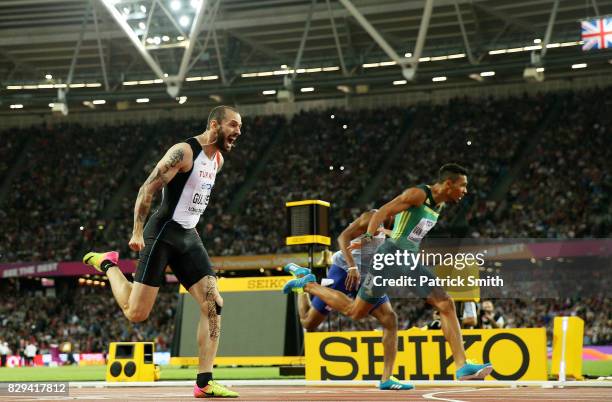 Ramil Guliyev of Turkey, gold and Wayde van Niekerk of South Africe, silver, cross the line in mens 200 metres final during day seven of the 16th...