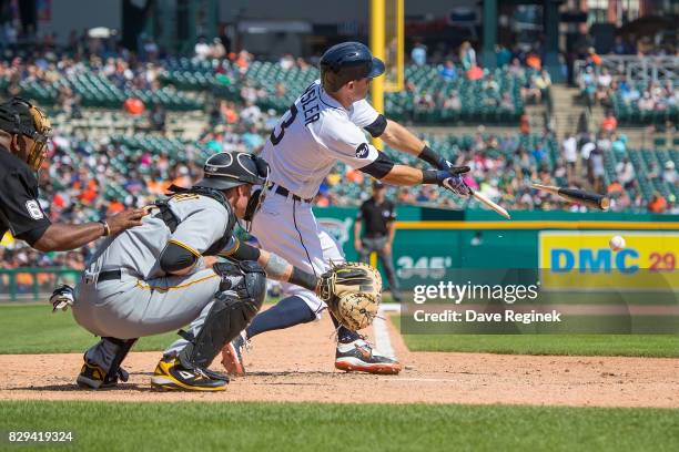 Ian Kinsler of the Detroit Tigers breaks his bat in the eighth inning against the Pittsburgh Pirates during a MLB game at Comerica Park on August 10,...