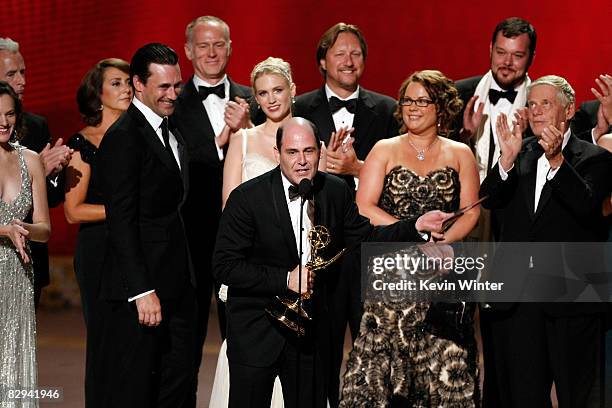 Writer/producer Matthew Weiner and crew accept the Outstanding Drama Series award for 'Mad Men' onstage during the 60th Primetime Emmy Awards held at...