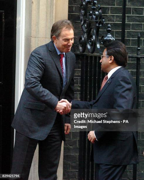 Britain's Prime Minister Tony Blair greets Pakistani president General Pervez Musharraf, outside 10 Downing Street, central London ahead of talks...