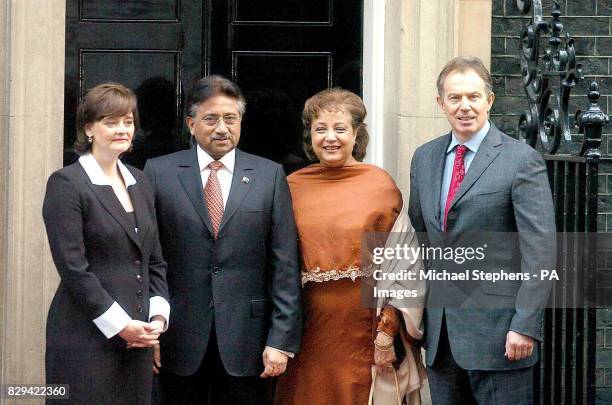 Britain's Prime Minister Tony Blair with wife Cherie greets Pakistani president General Pervez Musharraf and his wife, Begum Sehba, outside 10...