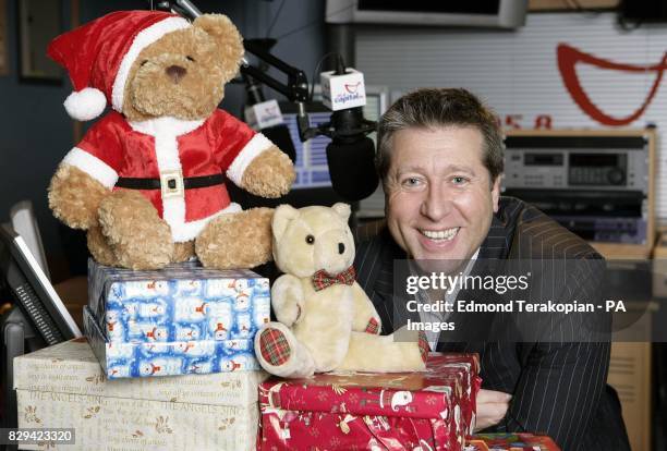 Patron of the charity, DJ Neil Fox at the Capital FM studios in central London, with some of the toys which will be distributed to 50,000...