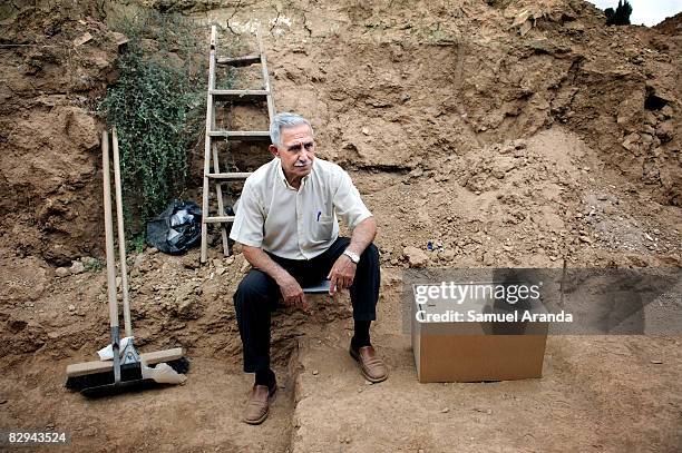 Pepe Dorado Cubero, age 74, rests during a break at the San Rafael mass grave where an estimated of 4500 bodies where found, September 9, 2008 in...