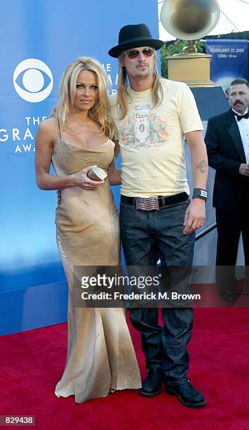 Actress Pamela Anderson poses with her boyfriend, musician Kid Rock at the 44th Annual Grammy Awards at Staples Center February 27, 2002 in Los...
