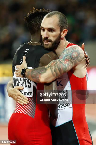 Ramil Guliyev of Turkey gold celebrates with Jereem Richards of Trinidad and Tobago, silver following the result in the mens 200 metres final during...