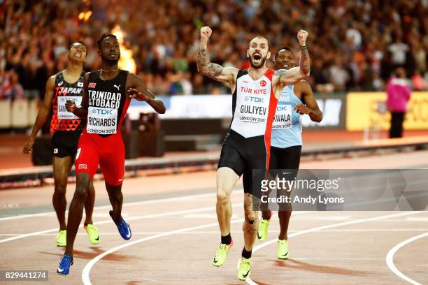 Ramil Guliyev of Turkey celebrates next to Jereem Richards of Trinidad and Tobago as he crosses the line to win the mens 200 metres final during day...