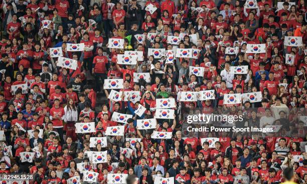 Korean Republic's fans cheer during the 2018 FIFA World Cup Russia Asian Qualifiers Final Qualification Round Group A match between Korea Republic vs...