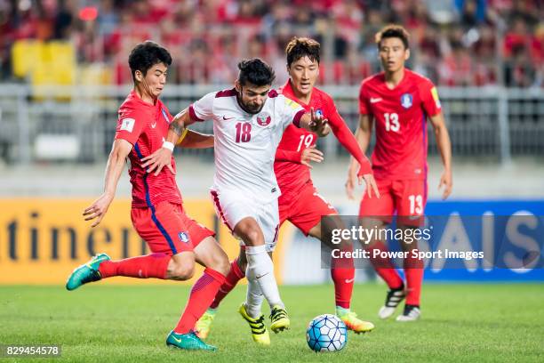 Luiz Junior of Qatar fights for the ball with Ki Sungyueng and Jung Wooyoung of Korea Republic during the 2018 FIFA World Cup Russia Asian Qualifiers...