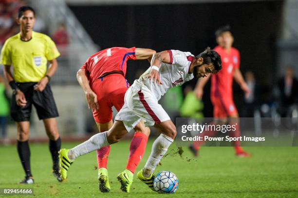 Luiz Junior of Qatar fights for the ball with Ji Dongwon of Korea Republic during the 2018 FIFA World Cup Russia Asian Qualifiers Final Qualification...