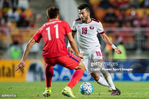 Ahmed Yasser of Qatar fights for the ball with Ji Dongwon of Korea Republic during the 2018 FIFA World Cup Russia Asian Qualifiers Final...