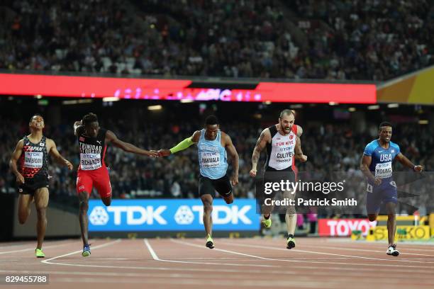 Ramil Guliyev of Turkey celebrates as he crosses the line to win also pictured are: Abdul Hakim Sani Brown of Japan, Jereem Richards of Trinidad and...