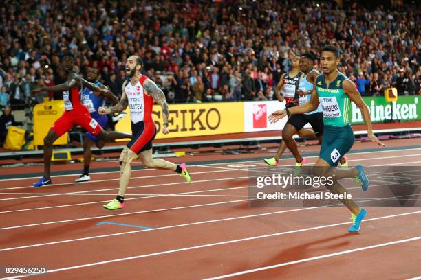 Ramil Guliyev of Turkey crosses the line to win the mens 200 metres final ahead of Isaac Makwala of Botswana during day seven of the 16th IAAF World...