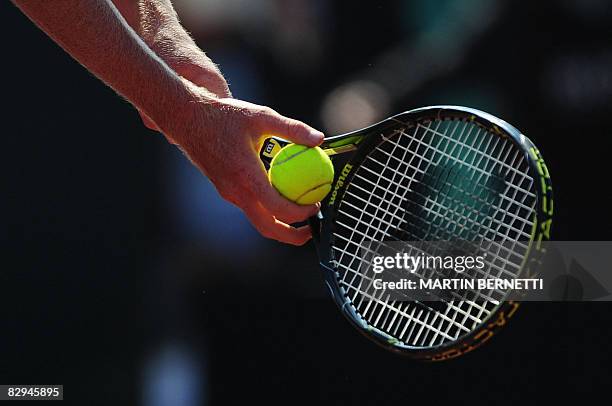 Australian tennis player Chris Guccione serves against Chilean Nicolas Massu during their Davis Cup 2008 World Group play-offs on September 19, 2008...