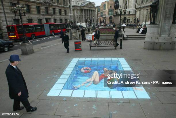 Illusion of a swimming pool by pavement artist Julian Beever.