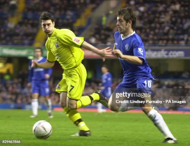 Chelsea's Joe Cole races Scunthorpe's Matthew Sparrow to the ball during