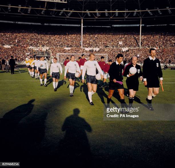 Referee Pierre Schwinte leads the teams out at Wembley, followed by England's Bobby Moore, George Cohen, Alan Ball, Roger Hunt, Ray Wilson, Geoff...
