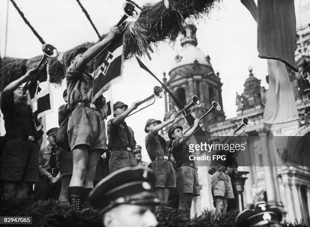 Members of the Hitler Youth play a fanfare during harvest festival celebrations in the Lustgarten, Berlin, 30th September 1934.