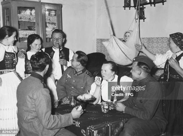German troops with a local family in the newly-established Protectorate of Bohemia and Moravia , 22nd March 1939. Adolf Hitler proclaimed the...